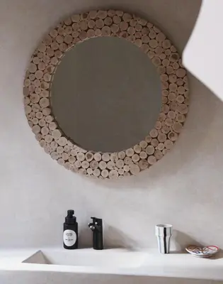 a mirror on a wall above a bathroom sink at Riad Soulmate in Marrakech