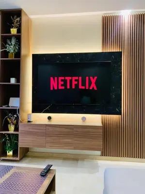 a television with the netflix sign on a wall at Expérience luxueuse Golf Prestigia Saphir BY KECH in Marrakech