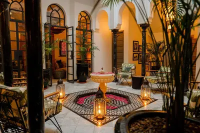 a lobby with a table with lights on it at Door Janna in Marrakech