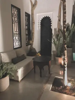 a living room with a couch and a table at Riad Dar-K in Marrakech