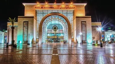 a large building is lit up at night at Appartement Nour 5 Marrakech in Marrakech