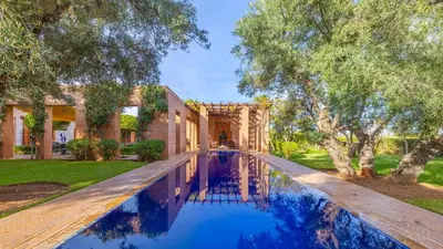 an estate with a swimming pool in front of a house at Villa Fairway One Amelkis in Sfiani