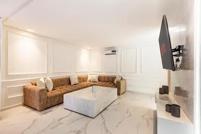 a living room with a couch and a coffee table at New Duplex Haut Standing à Victor Hugo, Gueliz in Marrakech