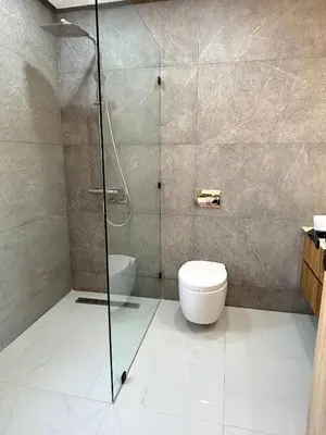 a bathroom with a toilet and a glass shower at Palais Siham in Marrakech