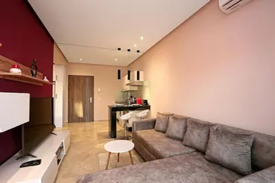 a living room with a couch and a table at Elegant and Brand new appart in hypercenter of Marrakech in Marrakech