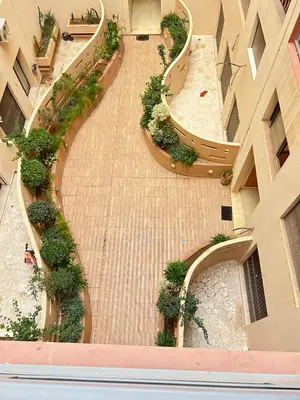 an overhead view of a hallway in a building with plants at Le Spacieux de Gueliz avec Piscine et Terasse in Marrakech