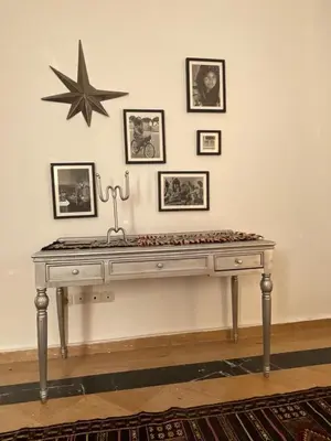 a table in a room with a star on the wall at Refined apartment DOWNTOWN in Marrakech