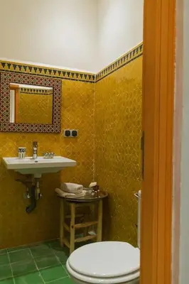 a bathroom with a toilet and a sink at Riad Pistache 135m2 in der Medina mit Terrasse in Marrakech
