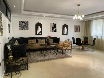 a living room with a couch and a table at Majorelle Chillax in Marrakech