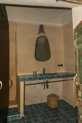 a bathroom with a sink and a mirror at Riad Moulaty 205m2 in der Medina mit Terrasse in Marrakech