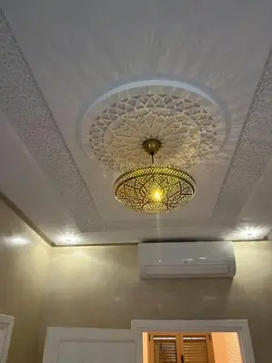 a ceiling with a chandelier in a room at Cozy Apartment Near Airport Terminal Modern Apartment Close to Airport in Marrakech