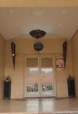 a room with a glass door with a window at appartement 29 entier avec balcon in Marrakech