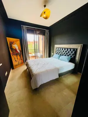 a bedroom with a bed and a large window at Les Jardin d'Atlas golf and Waky with private Pool in Marrakech