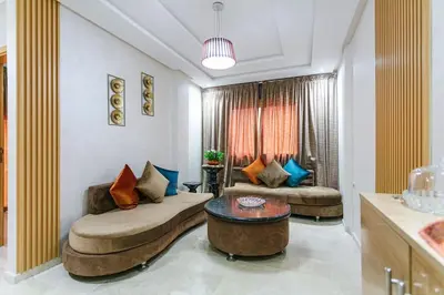 a living room with two couches and a table at Guéliz Cosy apart 2 Bedrooms in Marrakech