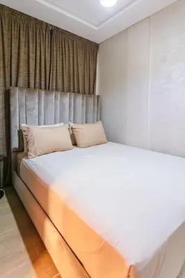a white bed with two pillows in a bedroom at Guéliz Cosy apart 2 Bedrooms in Marrakech