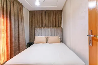 a bedroom with a bed with two pillows on it at Guéliz Cosy apart 2 Bedrooms in Marrakech