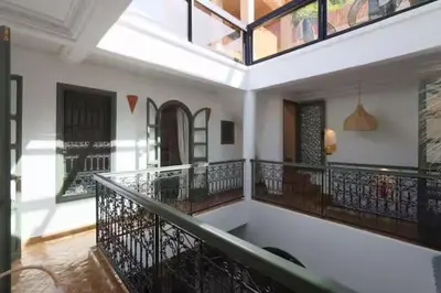 a room with a balcony with a bath tub at Riad Ptit Kech, Bassin terrasse - Petits déjeuners in Marrakech