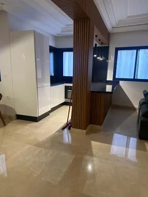 a room with a mop in the middle of a kitchen at Appartement Neuf Carré EDEN in Marrakech