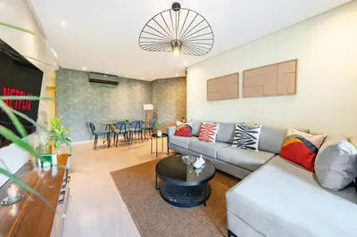 a living room with a couch and a table at stylish appart with 3Bedrooms in Prestigia in Marrakech
