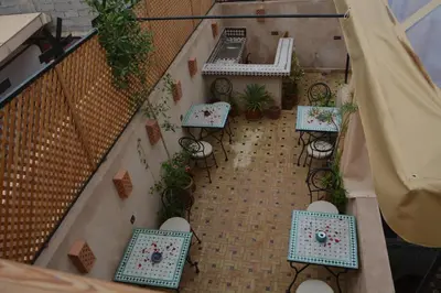 an overhead view of a patio with tables and chairs at Riad marrakesh peace in Marrakech