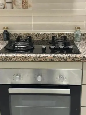 a stove top oven sitting in a kitchen at Spacious Apartment in Menara, 80 m² with View in Marrakech