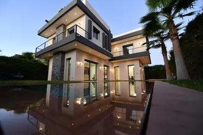 a house with a swimming pool in front of it at villa noria golf 4 chambres centre ville in Marrakech