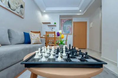 a chess board on a table in a living room at New elegant apartment with 2 bedroom in Marrakech
