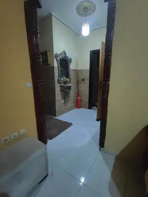 a hallway with a mirror in a room at zone 44 Massira 3 in Marrakech