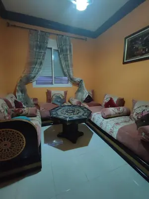a living room with couches and a table at zone 44 Massira 3 in Marrakech