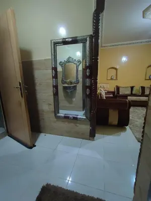 a bathroom with a mirror and a sink at zone 44 Massira 3 in Marrakech