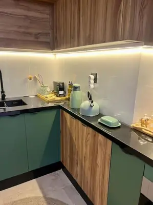 a kitchen with a sink and a counter top at Appartement Marrakech Hivernage N4 RESIDENCE CAPRICE PALACE in Marrakech