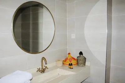 a bathroom with a sink and a mirror at Premium Stay in Marrakech