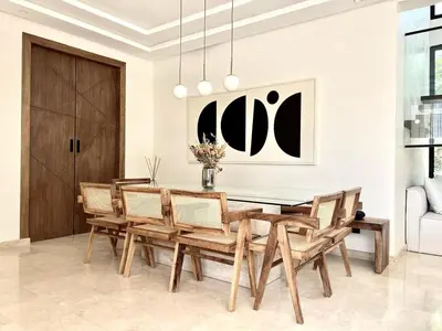 a dining room with a table and chairs at villa white in Marrakech