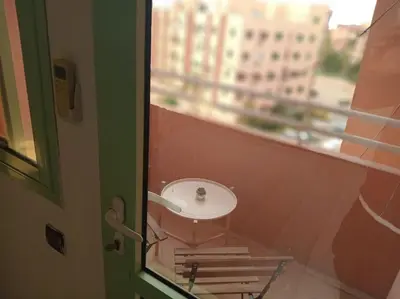 a bathroom with a sink next to a window at appartement de luxe marrakech in Marrakech