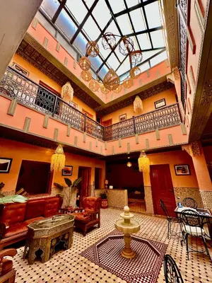 a large living room with a large skylight at Riad Almonds Marrakech in Marrakech