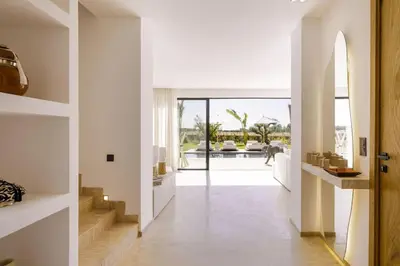 a hallway of a house with a view of a pool at Dar Al Jenna - Villa de luxe avec piscine privée in Marrakech
