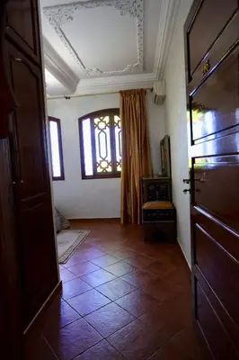 a room with a door and a tiled floor at Villa Les Terrasses Des Jardins in Marrakech