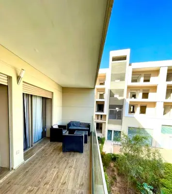 an apartment balcony with a view of a building at AMIZING Apartments Marrakech WAZO in Marrakech