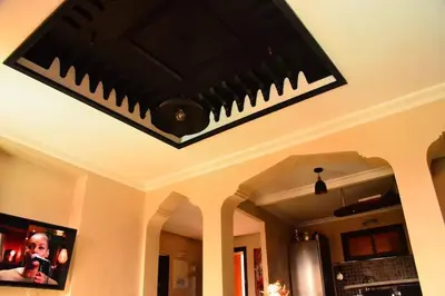a chandelier hanging from a ceiling in a kitchen at Oasis aux Palmeraies à Marrakech in Marrakech