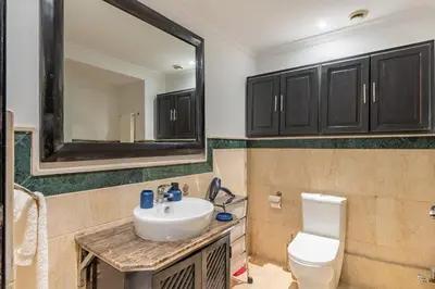 a bathroom with a sink and a toilet and a mirror at Amazing apartment in the heart of Marrakesh in Marrakech