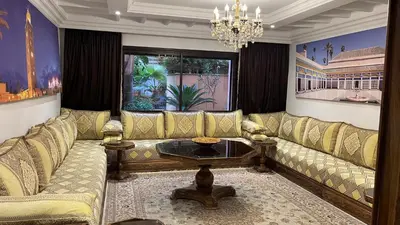 a living room with a couch and a table at Amazing apartment in the heart of Marrakesh in Marrakech