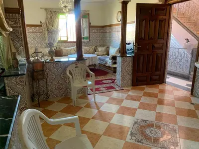 a living room with a couch and a table at Apparemment Aglmous in Marrakech
