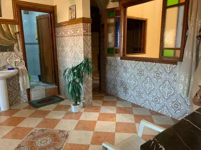 a bathroom with a shower and a sink and a toilet at Apparemment Aglmous in Marrakech