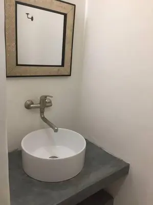 a white sink on a counter in a bathroom at Riad Charij in Marrakech