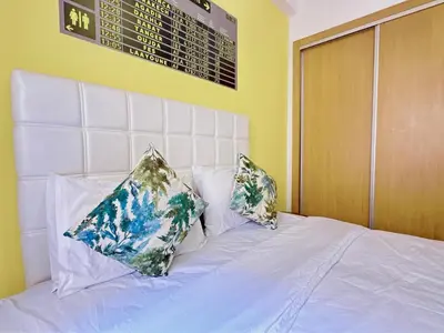 a white bed with two pillows on top of it at Apparemment in marrakech in Marrakech