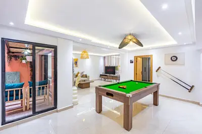 a living room with a pool table in it at Verdelune Apartments in Marrakech