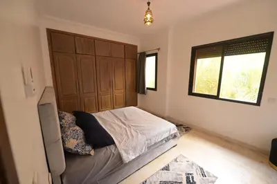 a bedroom with a bed and a window at Carisia Liam in Marrakech