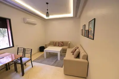 a living room with a couch and a table at Carisia Liam in Marrakech