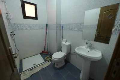 a bathroom with a toilet and a sink at Carisia Liam in Marrakech