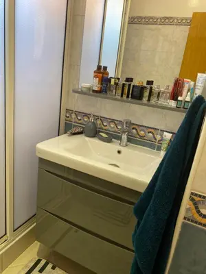 a bathroom with a sink and a mirror at Apparemment in Marrakech